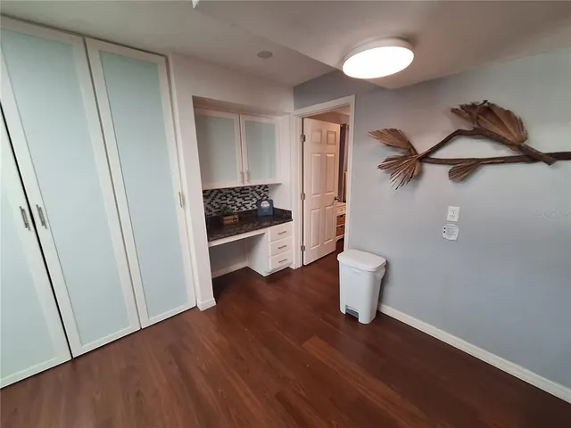 a view of a hardwood floor and a sink in a room