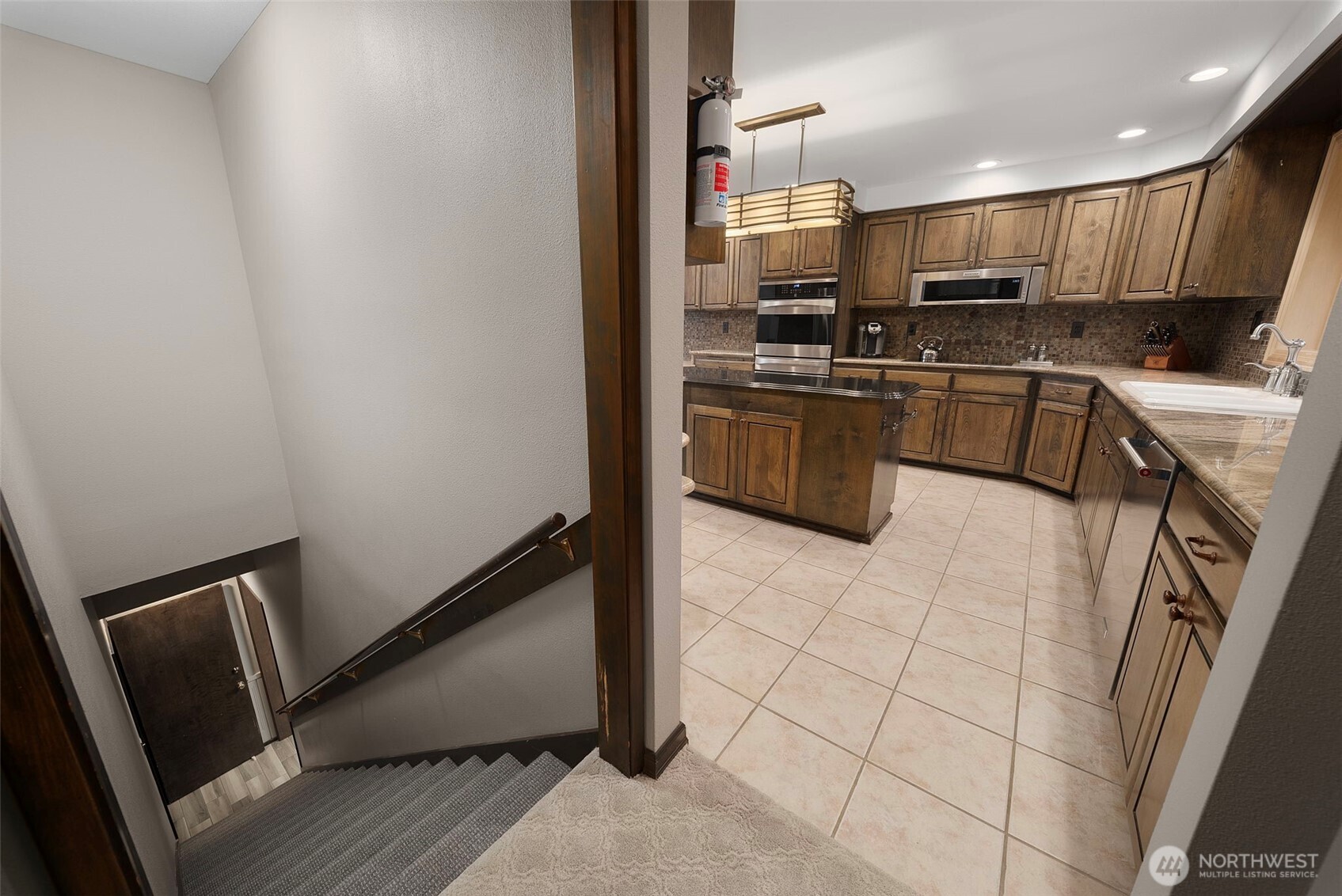 3321 Cooks Hill Road Centralia, WA 98531 - Photo 12 of 37 a kitchen with stainless steel appliances a refrigerator a sink a stove a microwave and cabinets