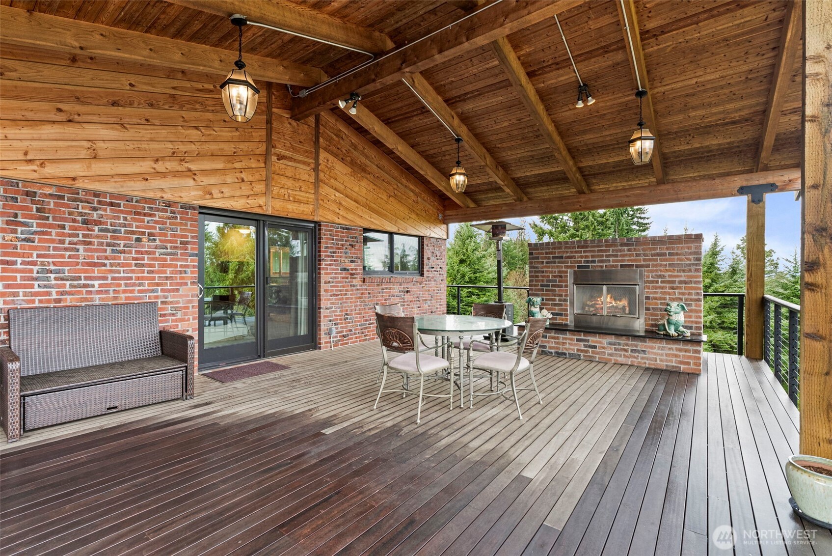 3321 Cooks Hill Road Centralia, WA 98531 - Photo 28 of 37 a view of a patio with table and chairs and wooden floor
