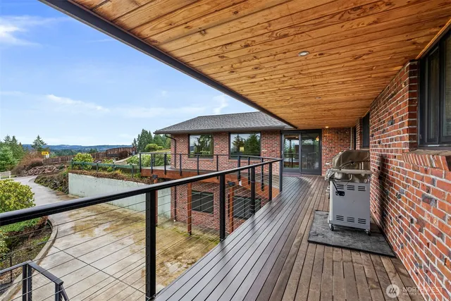 a view of a balcony with wooden floor
