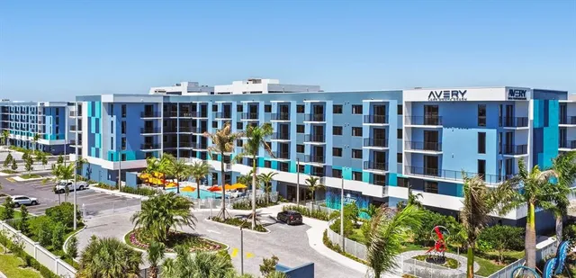 a view of building with balcony and seating space