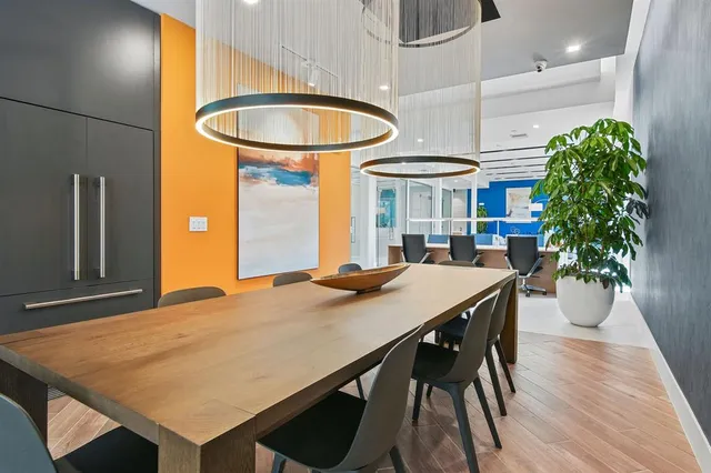 a dinning table and chairs in a room