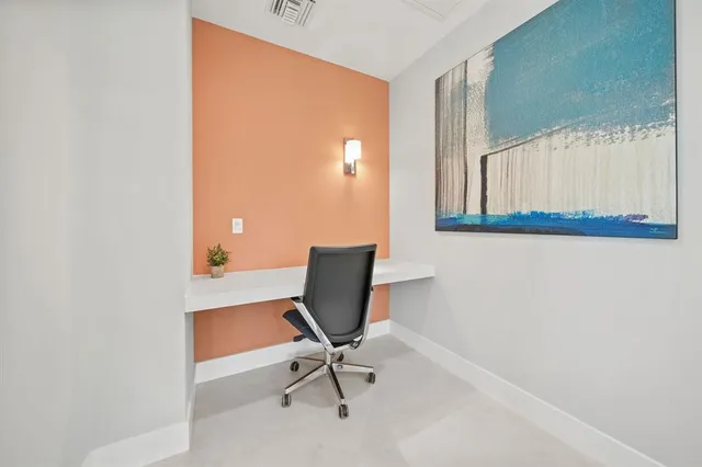 a view of a workspace with furniture