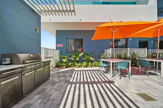 swimming pool view with a seating space