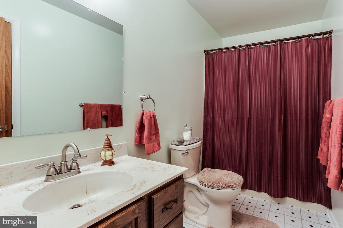 921 Emory Church Road Upperco, MD 21155 - Photo 17 of 30 a bathroom with a sink vanity mirror and toilet