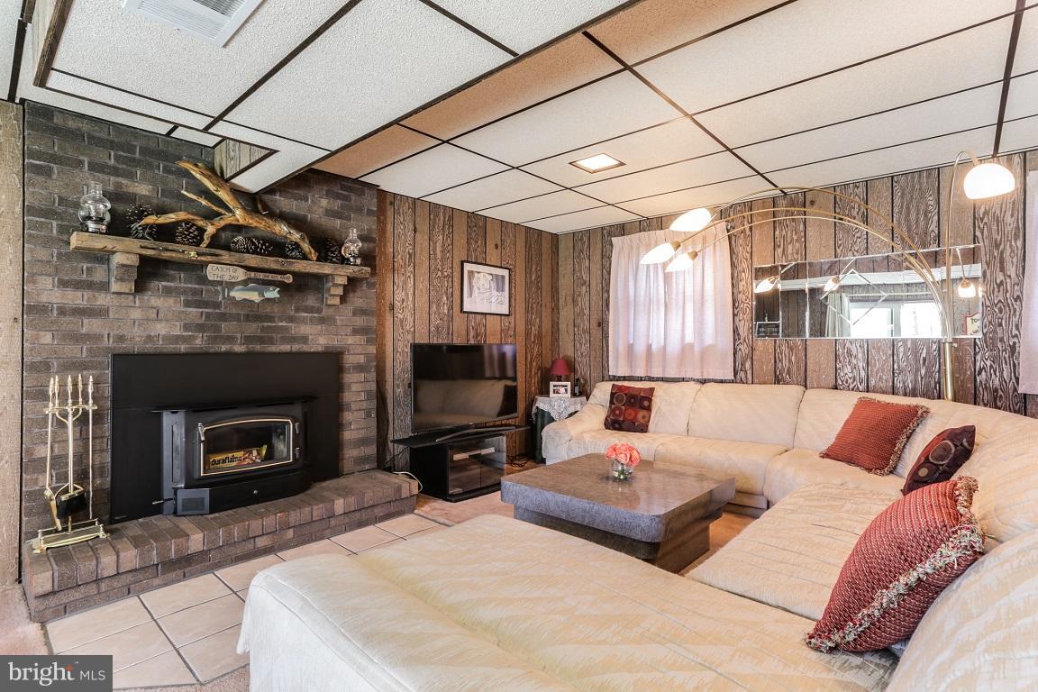 921 Emory Church Road Upperco, MD 21155 - Photo 20 of 30 a living room with furniture and a fireplace