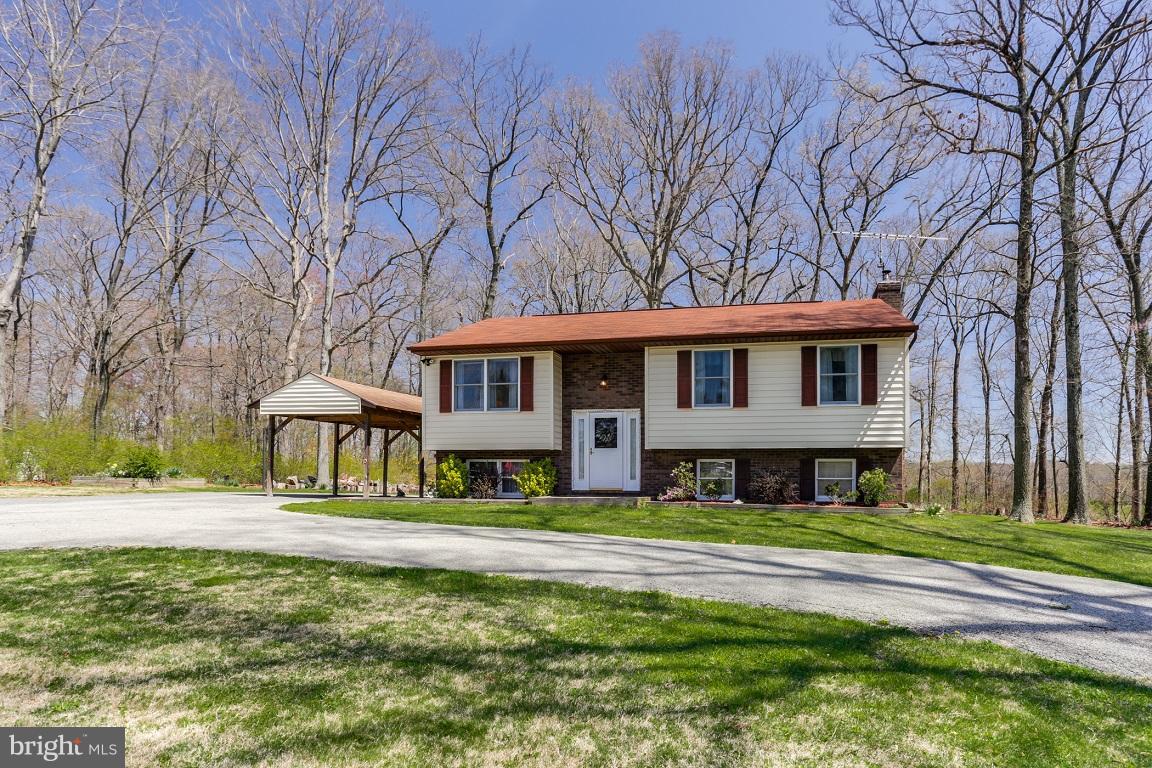 921 Emory Church Road Upperco, MD 21155 - Photo 3 of 30 a front view of a house with a yard