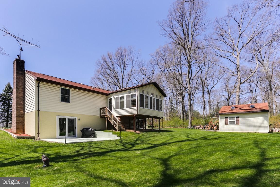 921 Emory Church Road Upperco, MD 21155 - Photo 24 of 30 a front view of a house with a yard and trees