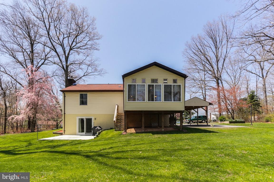 921 Emory Church Road Upperco, MD 21155 - Photo 25 of 30 a front view of a house with a garden