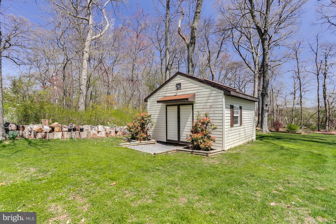 921 Emory Church Road Upperco, MD 21155 - Photo 28 of 30 a front view of a house with garden