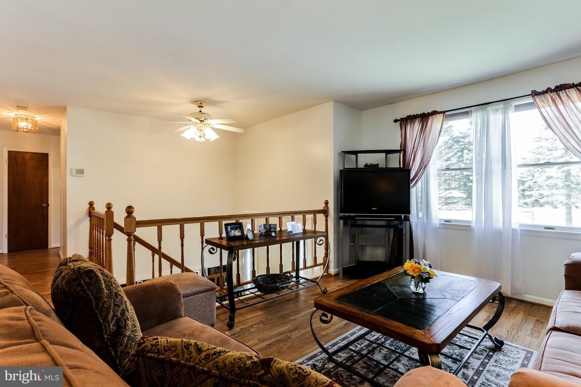 921 Emory Church Road Upperco, MD 21155 - Photo 4 of 30 a living room with furniture fireplace and flat screen tv