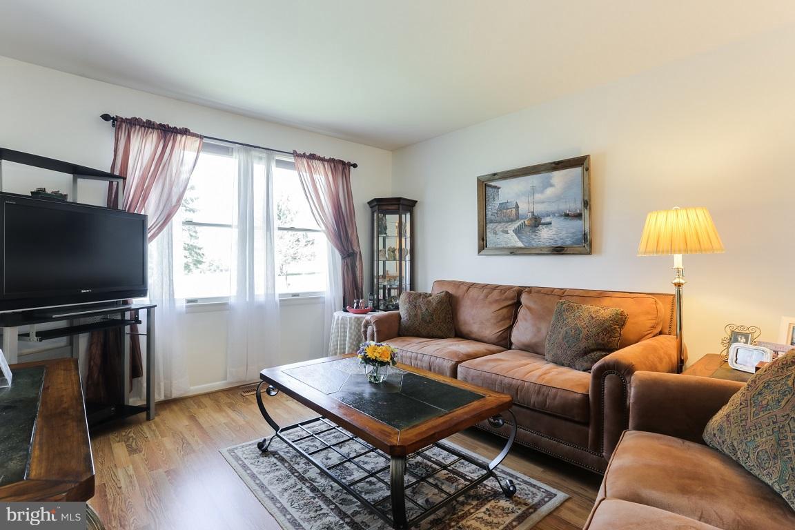 921 Emory Church Road Upperco, MD 21155 - Photo 6 of 30 a living room with furniture a flat screen tv and a window