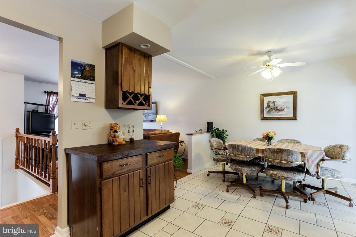 921 Emory Church Road Upperco, MD 21155 - Photo 9 of 30 a kitchen with a sink and a stove top oven with wooden floor
