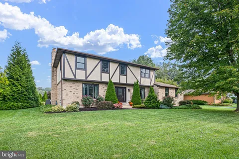 a front view of house with garden