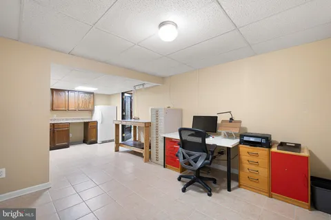 a view of a workspace with furniture