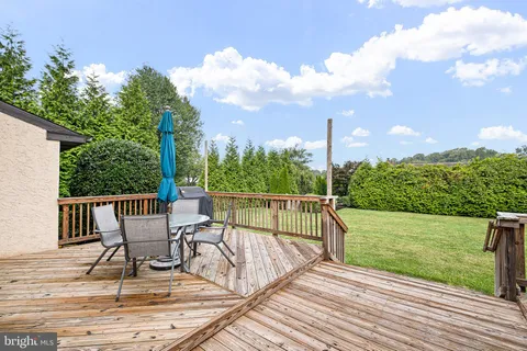 a view of a chairs and table on the wooden floor