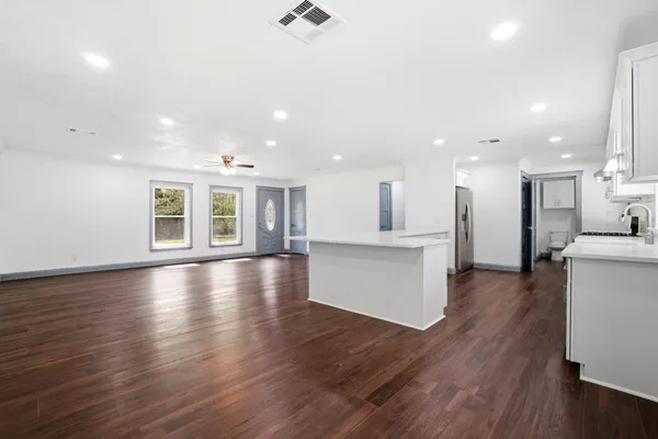 a view of kitchen with furniture and wooden floor