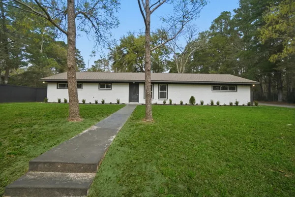 a front view of house with garden