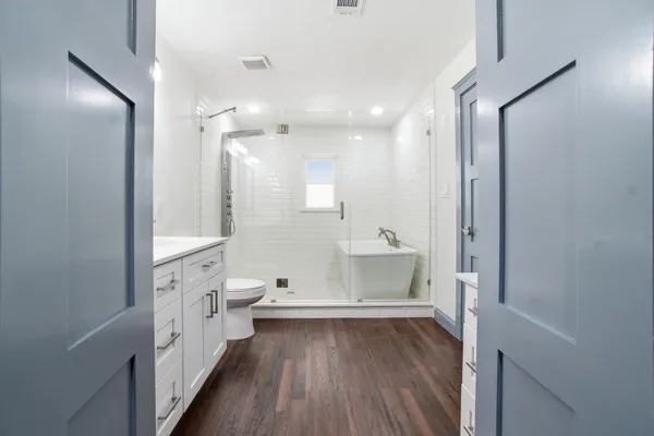 a bathroom with a bathtub and a sink
