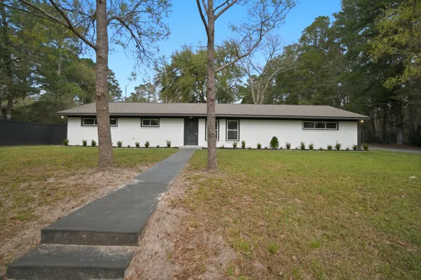 a front view of house with garden