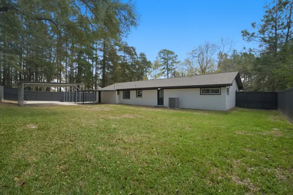 a front view of house with a garden