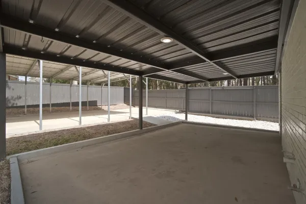 a view of an empty room with wooden frame
