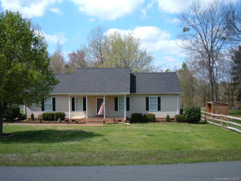 3527 East North Corner Road Lancaster, SC 29720 - Photo 2 of 23 a front view of a house with a garden and trees