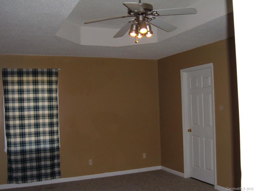 3527 East North Corner Road Lancaster, SC 29720 - Photo 11 of 23 a view of a livingroom with a chandelier fan