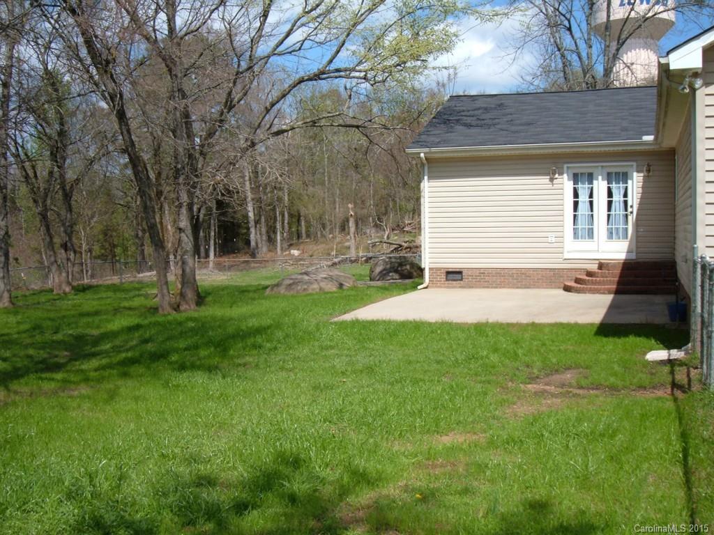 3527 East North Corner Road Lancaster, SC 29720 - Photo 19 of 23 a view of a backyard with a large tree
