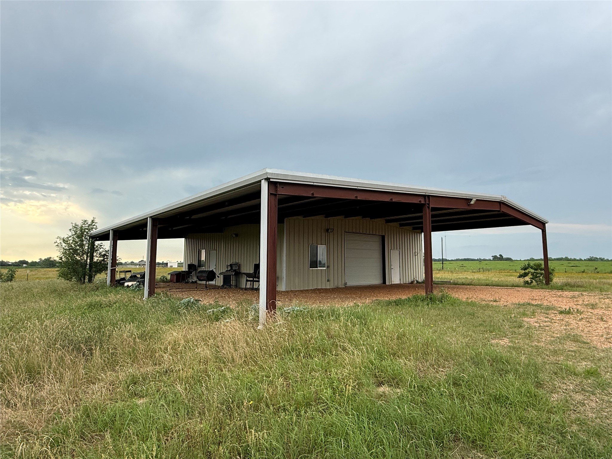 1240 Crooked Road Cat Spring, TX 78933 - Photo 9 of 20 a view of a house with backyard and trees