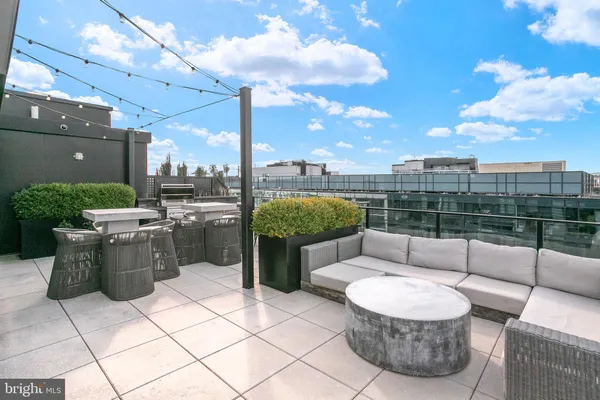 a balcony with furniture and city view