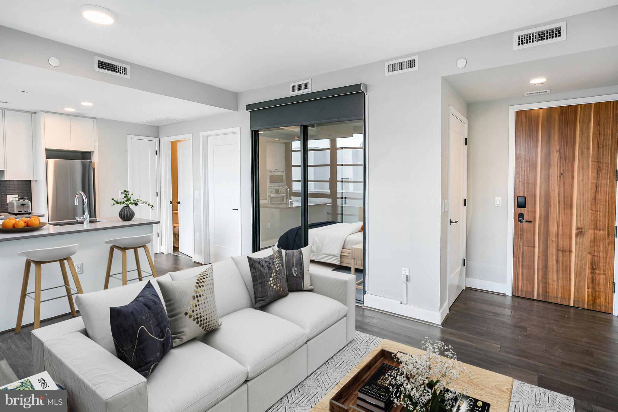 1300 4th Street Southeast, Unit 901 Washington, DC 20003 - Photo 2 of 27 a living room with furniture and a large window