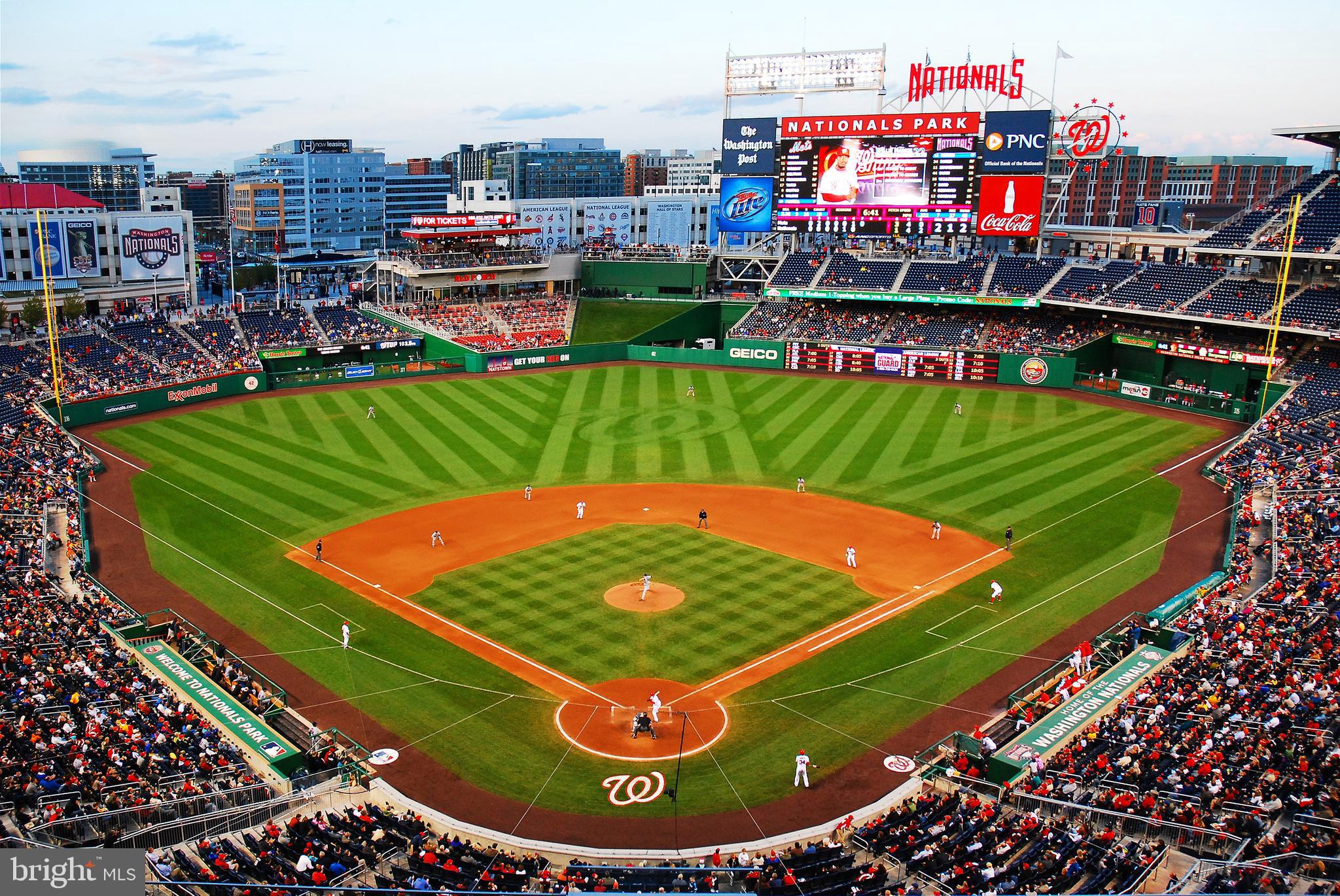 1300 4th Street Southeast, Unit 901 Washington, DC 20003 - Photo 22 of 27 a view of a tennis ground with a large pool