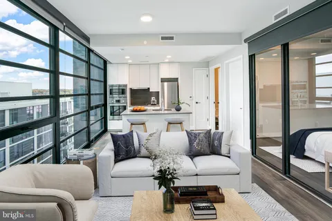 a living room with furniture and a painting