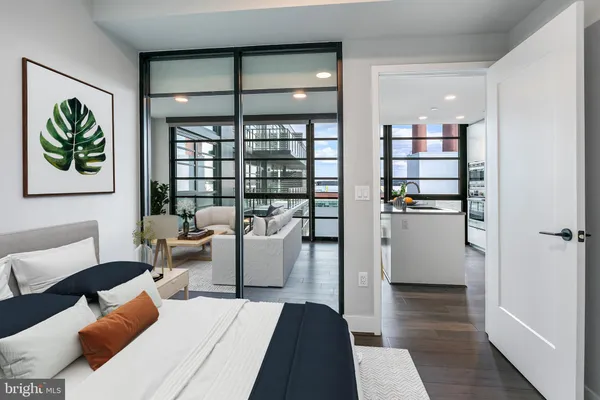 a living room with furniture and a book shelf
