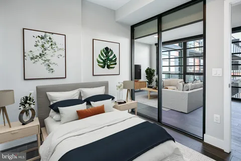 a bedroom with a bed and a couch