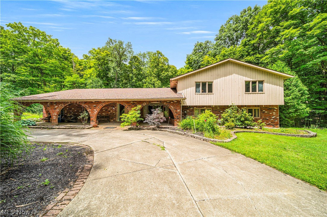 12200 Caves Road Chesterland, OH 44026 - Photo 3 of 43 Tri-level home featuring a front lawn
