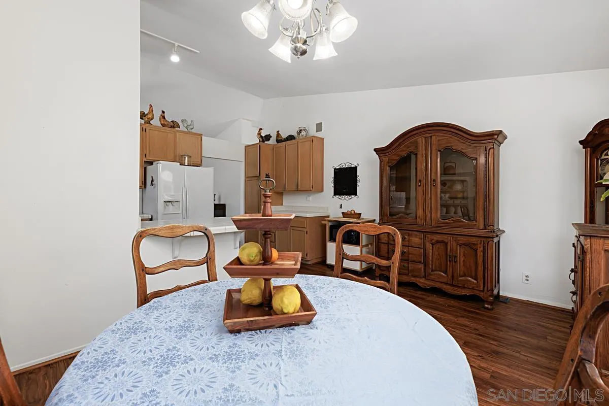1505 Avenida Oceano Oceanside, CA 92056 - Photo 14 of 26 a living room with furniture a flat screen tv and kitchen area