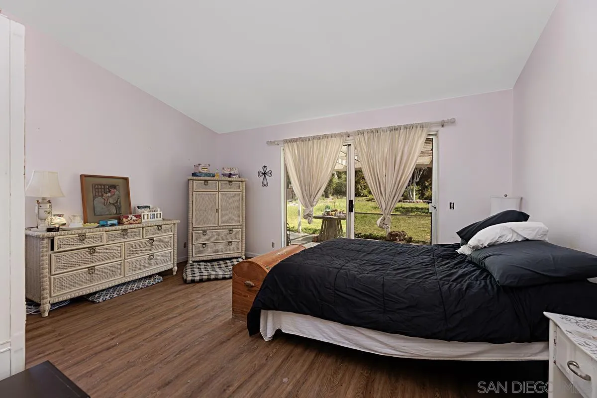 1505 Avenida Oceano Oceanside, CA 92056 - Photo 16 of 26 a bedroom with a bed and a large window