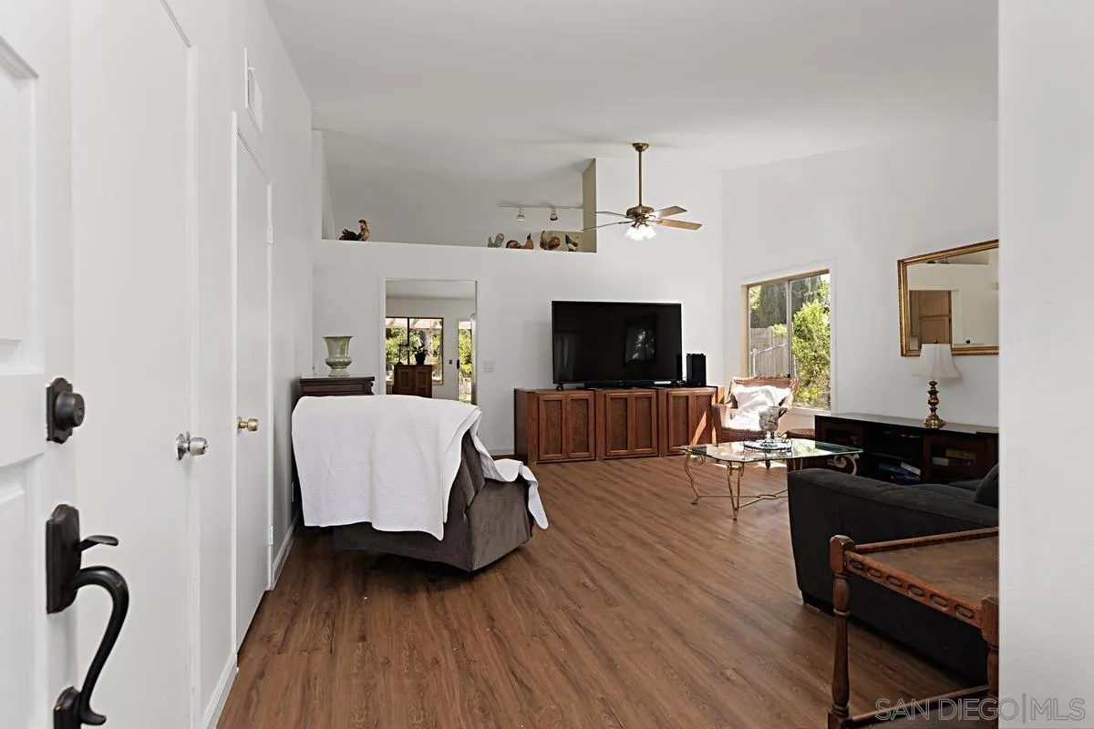 1505 Avenida Oceano Oceanside, CA 92056 - Photo 4 of 26 a living room with furniture and a flat screen tv