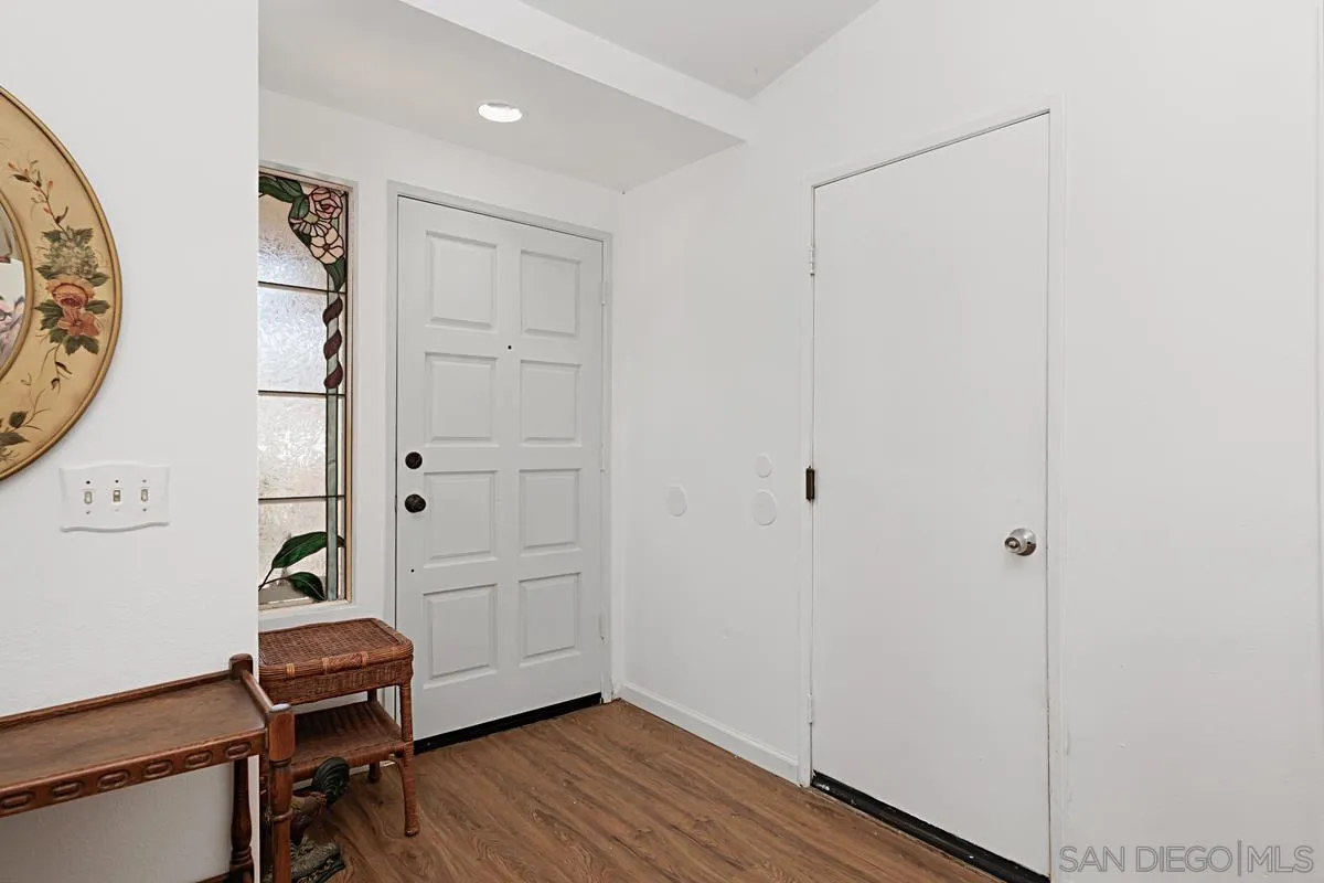 1505 Avenida Oceano Oceanside, CA 92056 - Photo 5 of 26 a view of a hallway with wooden floor and closet