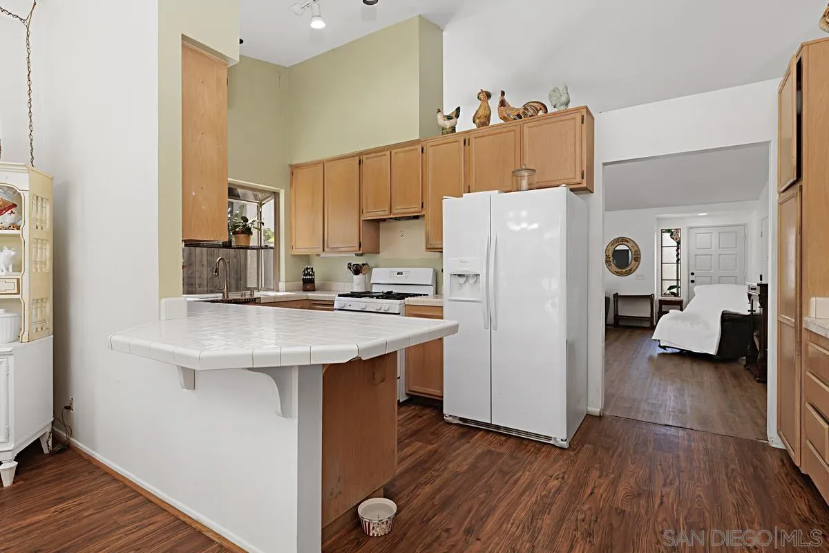 1505 Avenida Oceano Oceanside, CA 92056 - Photo 8 of 26 a kitchen with stainless steel appliances a refrigerator and a stove