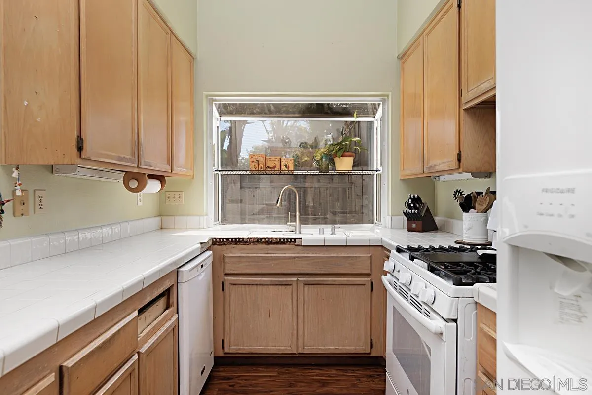 1505 Avenida Oceano Oceanside, CA 92056 - Photo 9 of 26 a kitchen with a sink and cabinets