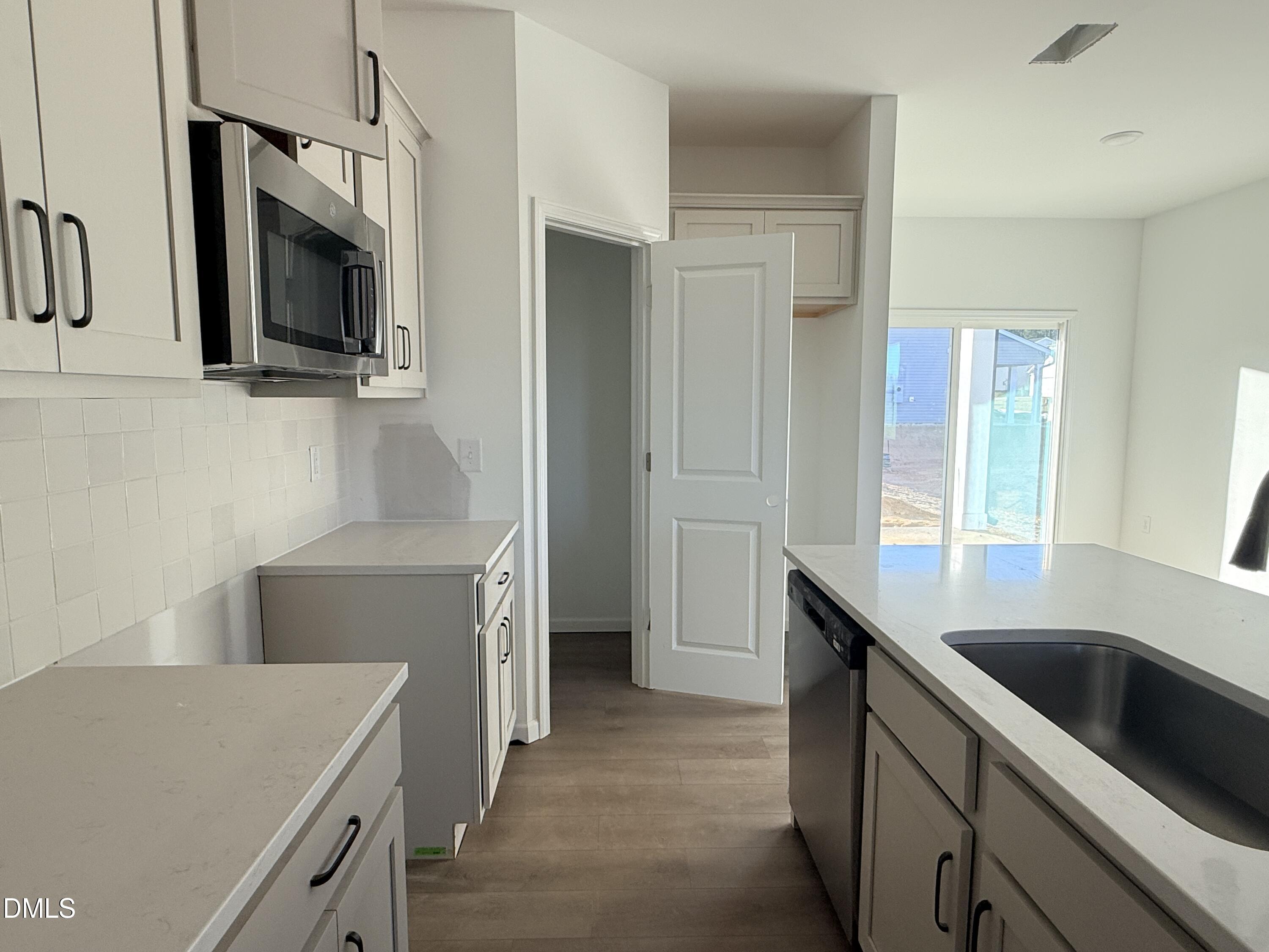 6726 Jersey Road Middlesex, NC 27557 - Photo 4 of 23 a kitchen that has a sink and a stove in it