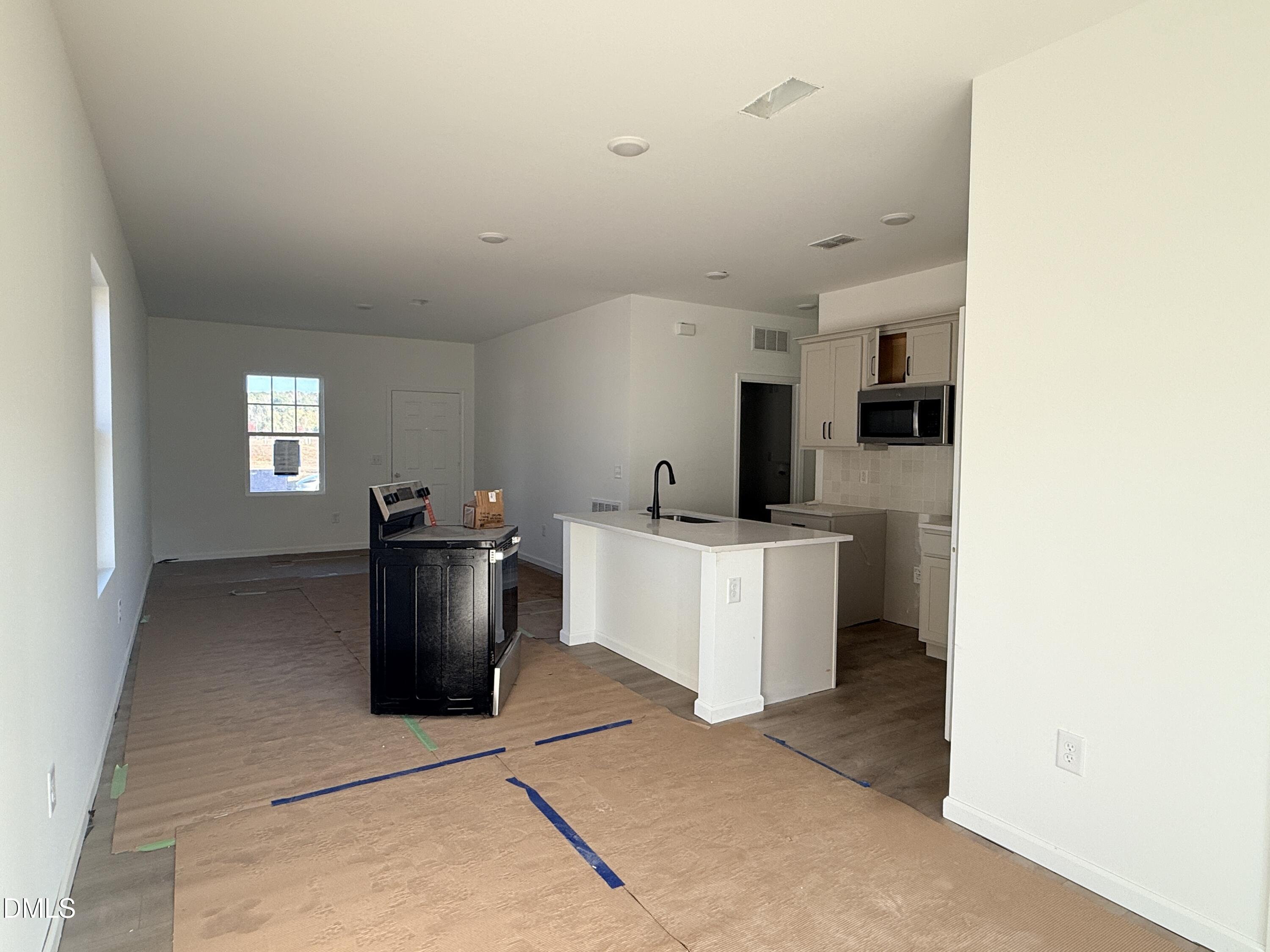 6726 Jersey Road Middlesex, NC 27557 - Photo 8 of 23 a view of a kitchen with appliances and cabinets