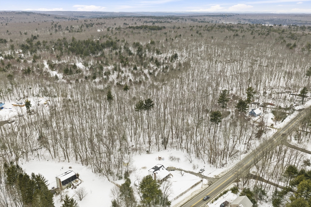 60 Webster Street Douglas, MA 01516 - Photo 7 of 14 a view of a dry yard with mountains in the background