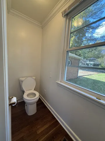 a bathroom with a toilet and a sink