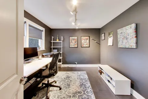 a workspace with furniture and window