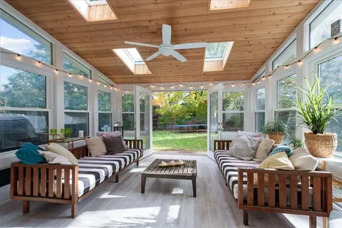a outdoor space with patio furniture and garden view