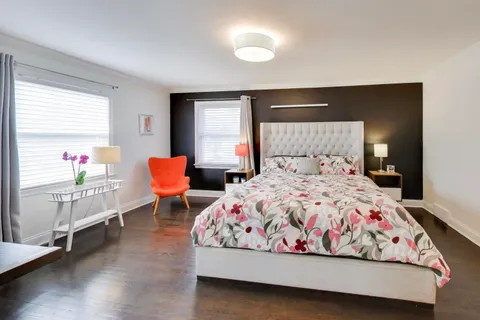 a bedroom with a bed and window